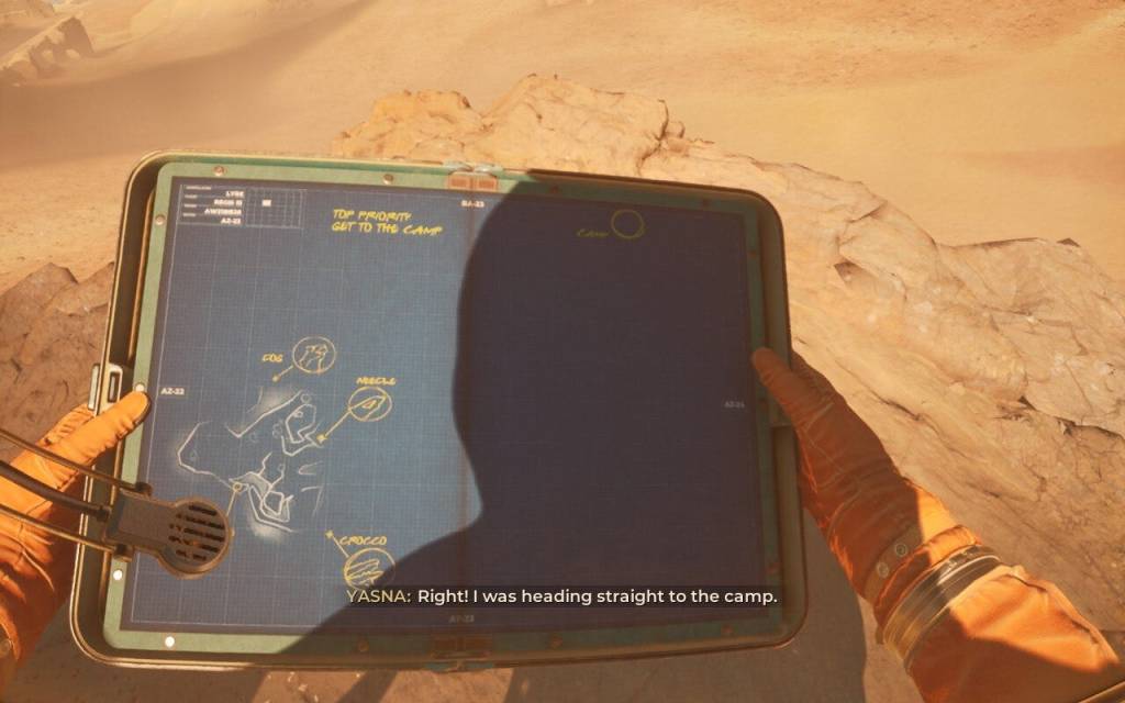 A map held in hands, with very small handwritten labels