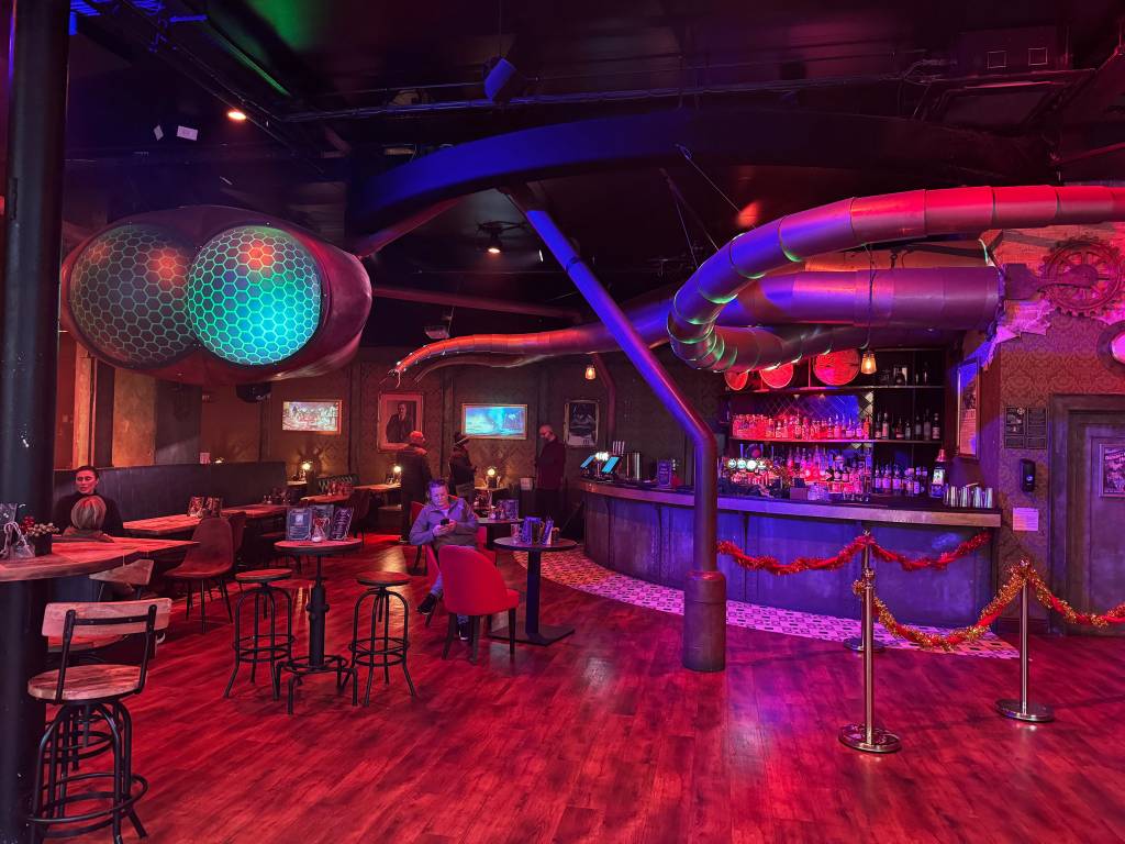 A bar with massive Martian eyes and steampunk theming