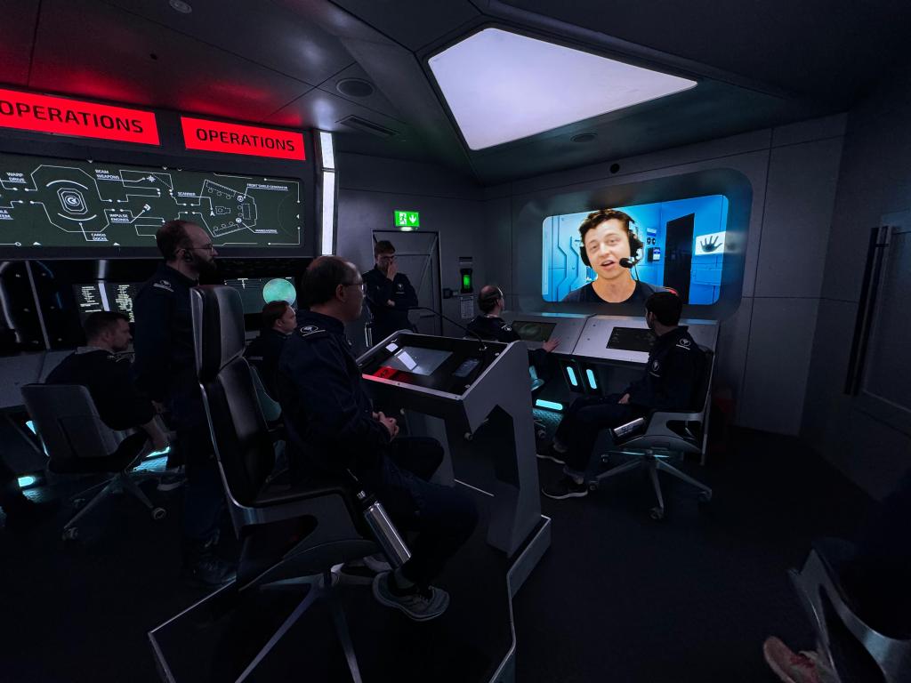 A man with an audio headset on the viewscreen