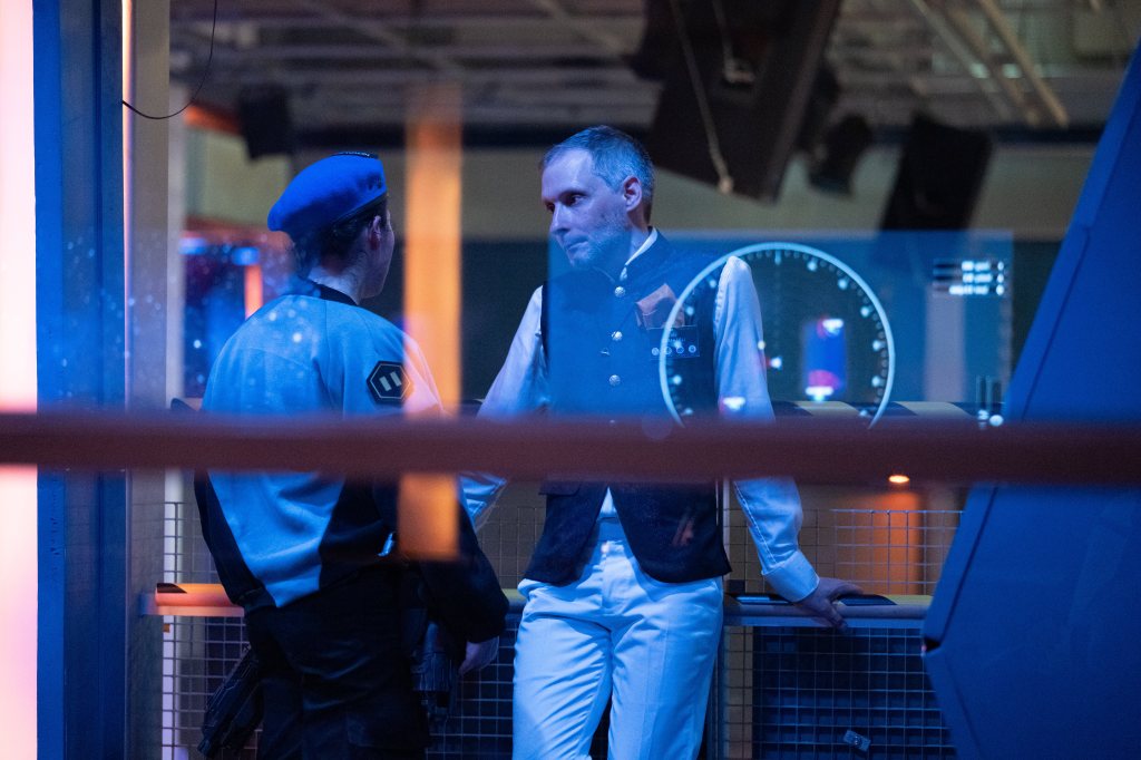 Two people in uniform having a discussion