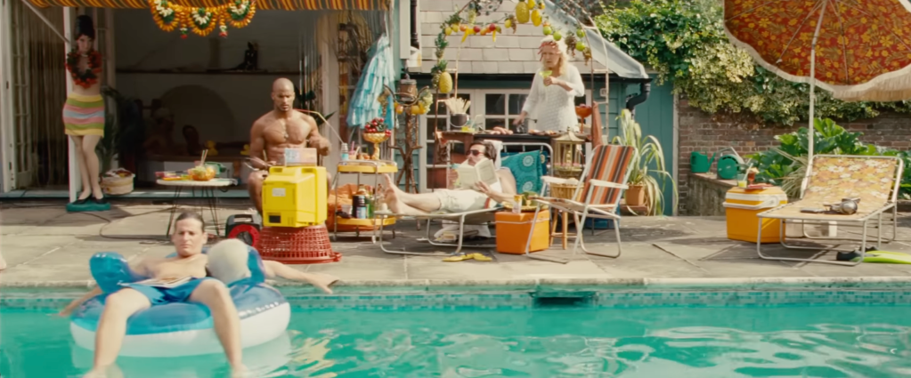 Actors lounging beside a sunny pool reading books and floating in the water