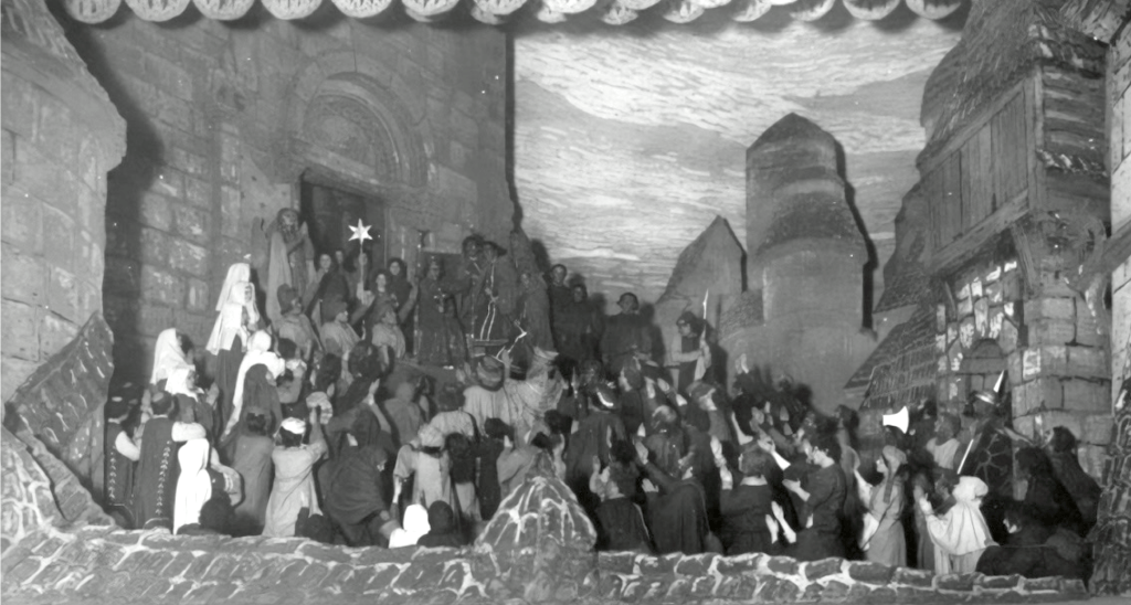Photo of a Cathedral set with lots of actors playing an 11th century audience