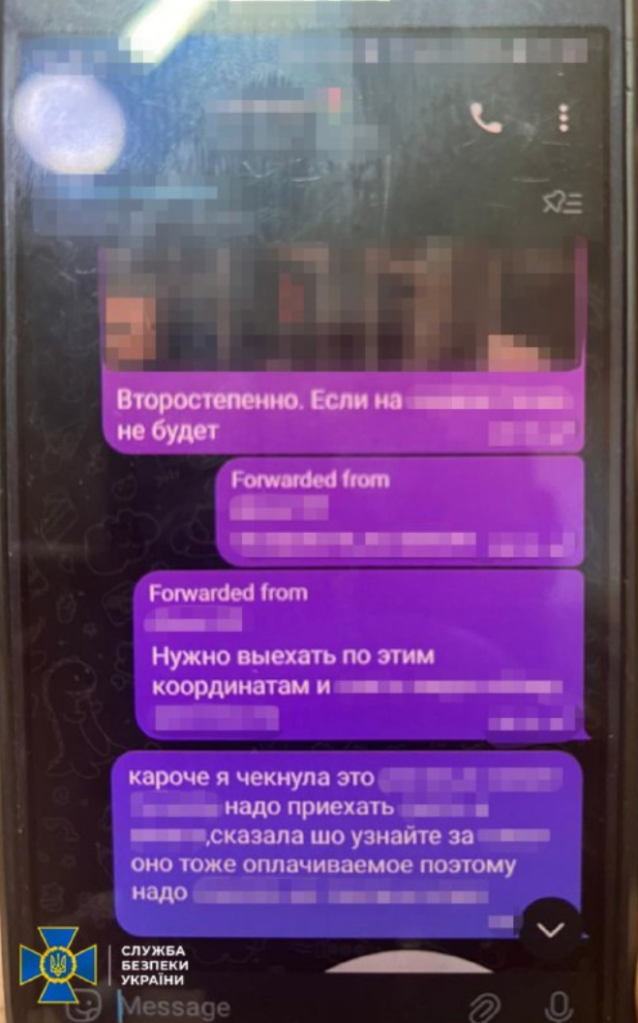 Photo of a chat on a smartphone with lots of text blurred out